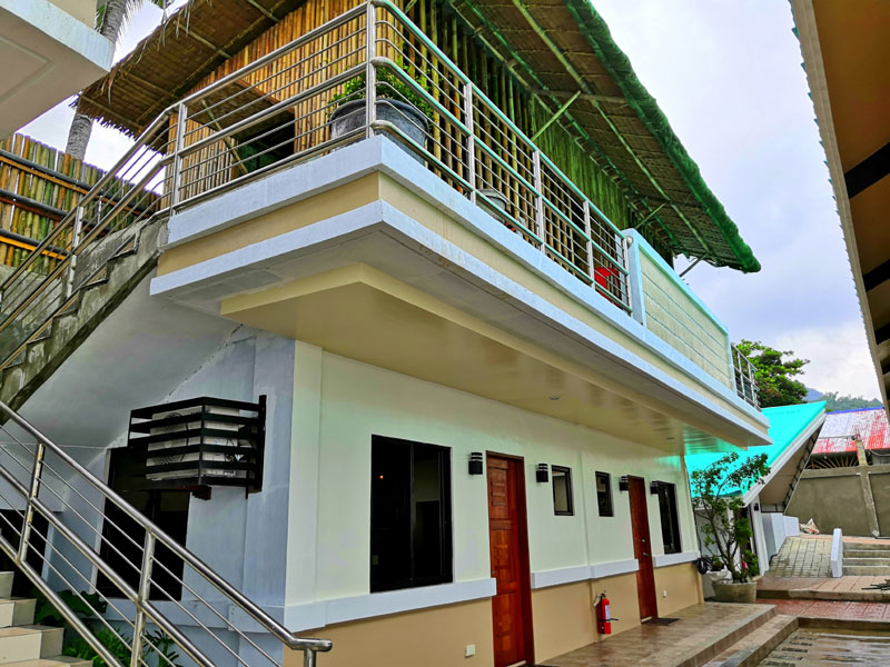 Aircon rooms and native huts in the second floor of Rosma Pebbled Cove Beach Resort.