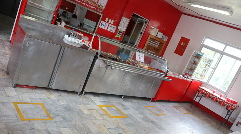 Floor markings have been placed around sites, such as in the canteen of Coca-Cola Iloilo plant seen here, to provide visual cues in order to practice physical distancing.