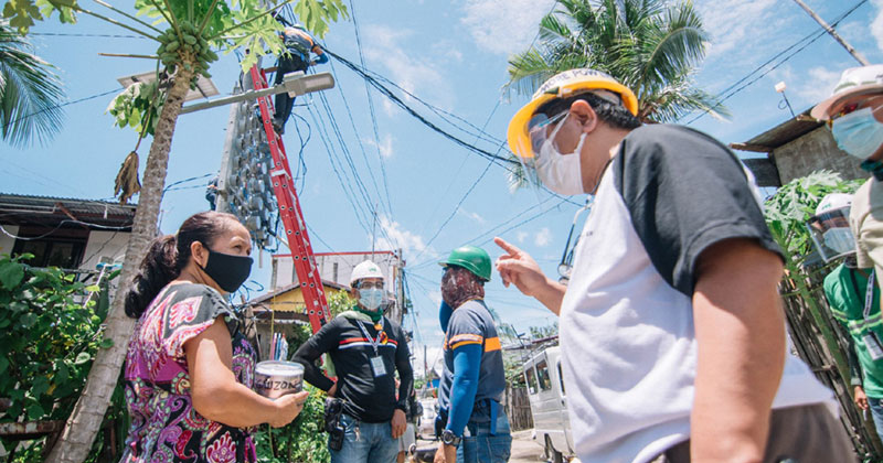 Castro out in the field talking to some MORE Power Iloilo consumers.