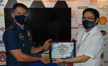 Chief Risk Officer Don Nino Santos receiving plaque of recognition from Police Lieutenant Michael Bernardo