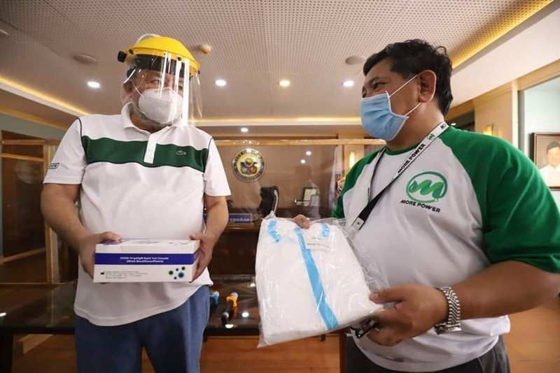 MORE Power President Roel Z. Castro turning over to Mayor Jerry Trenas the company's donations of PPEs, test kits, etc for COVID-19 response of Iloilo City.