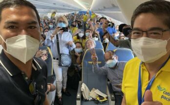 Cebuano native Mr. Salbert Garces poses with LYG as he is proclaimed CEB's 200 millionth passenger via Manila-Cebu flight 5J 575.