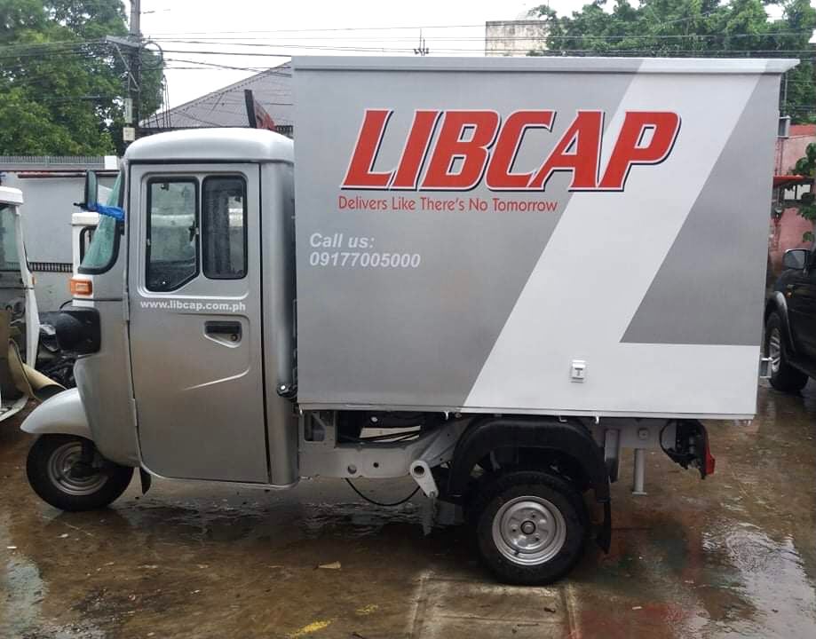 Libcap delivery using Bajaj 3-wheelers.