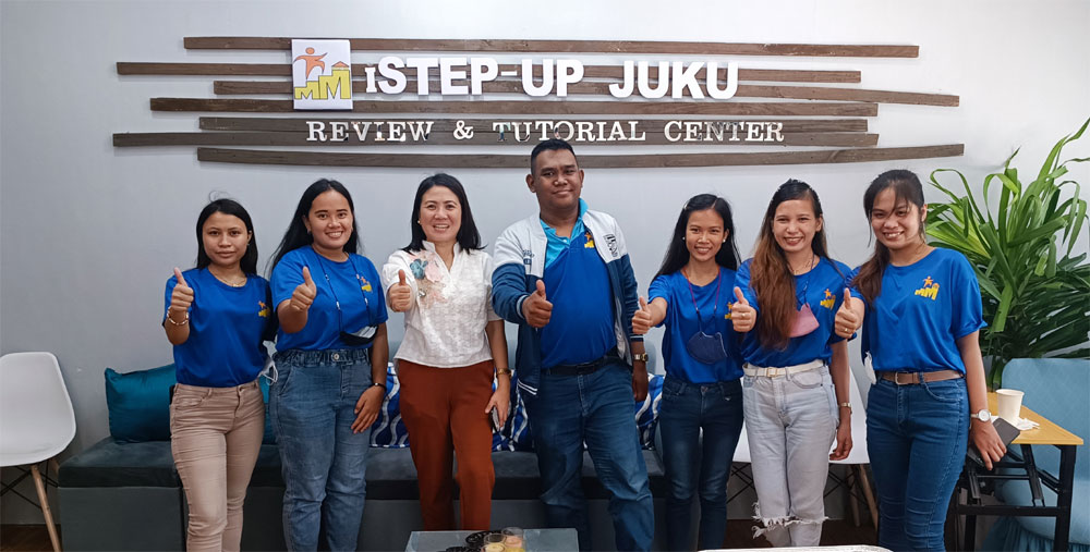 Mary Ann F. Morano (3rd from Left), founder of iSTEP-UP JUKU, with some teachers of the review and tutorial center.
